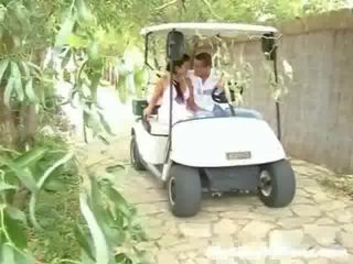 A schoolgirl and her partner are driving around in a golf cart. Suddenly they stop and the juvenile initiates to touch the girl up,
